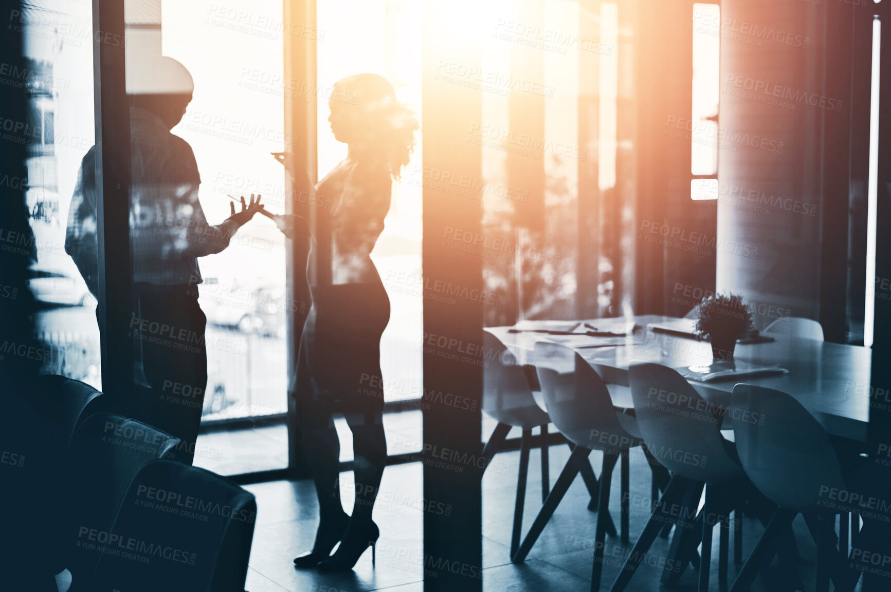 Buy stock photo Business people, meeting and discussion with team in boardroom for morning at office. Businessman and woman discussing project, proposal or ideas with silhouette, glare or lens flare at workplace