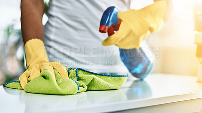 Buy stock photo Shot of an unrecognizable woman cleaning a table at home