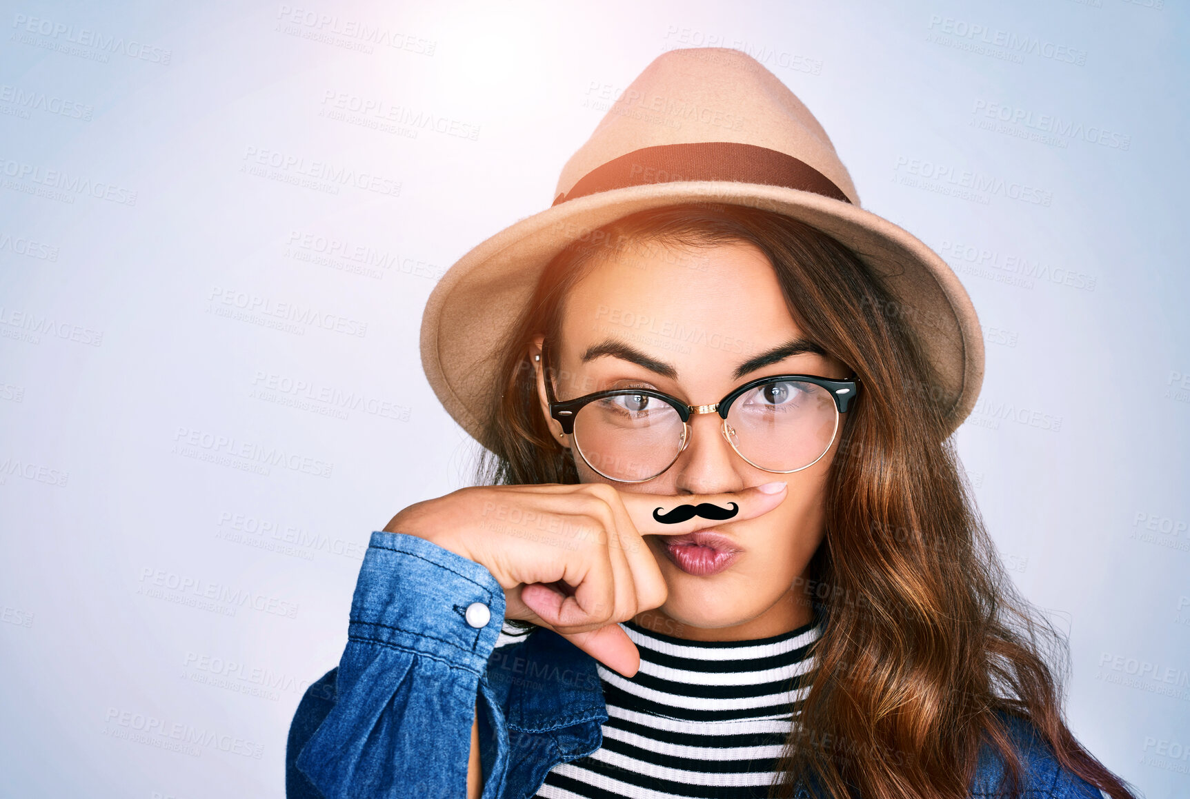 Buy stock photo Portrait, woman and fashion with moustache in studio for funny, comic and funky aesthetic of dress up party. Silly, female person and trendy hat, brand eyewear and pout for event on white background