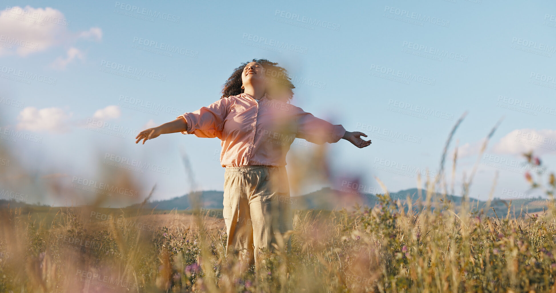 Buy stock photo Woman, freedom and dancing in field of flowers, countryside and peace in sustainable environment. Female person, holiday and adventure in nature or outdoors, calm and zen or wellness on vacation