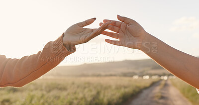 People, hands and connection in sunset love for holiday bonding, romance or affection. Couple, fingers and touching on vacation for honeymoon together or outdoor sunshine, partnership or marriage