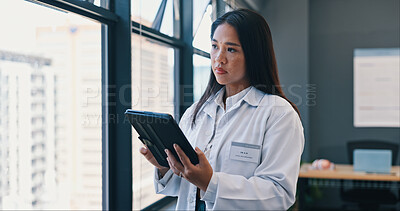 Woman, tablet and doctor thinking in hospital for online consulting, telehealth and wellness app. Window, healthcare medicine or nurse with ideas for internet tips, medical research or patient data