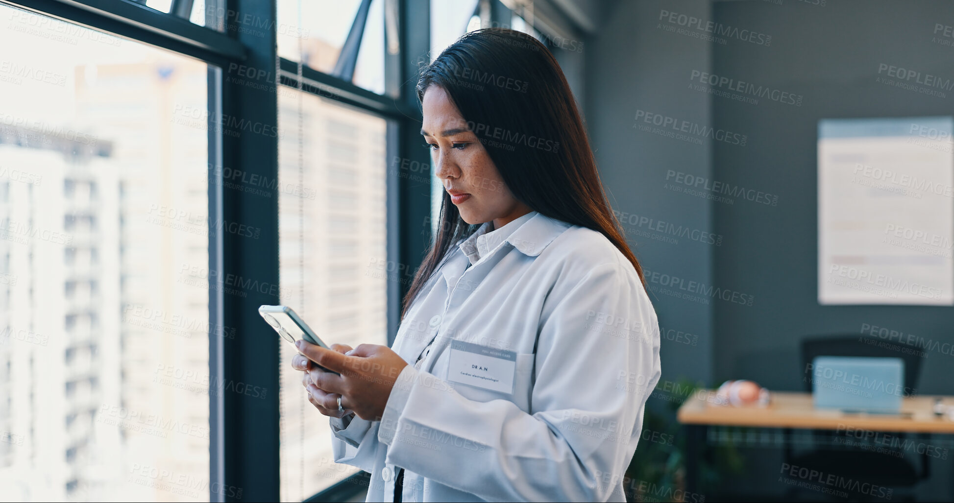 Buy stock photo Research, doctor and tablet in hospital with thinking for schedule, telehealth or medical treatment. Indonesian woman, digital technology planning with information, diagnosis or online consultation