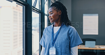 Nurse, healthcare and thinking at window of hospital with ideas for surgery, medical decision or happy. Medicine, black woman and professional intern thoughtful in the clinic with wonder and smile