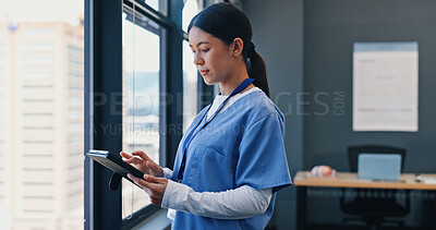 Window, tablet and nurse thinking in hospital for online consulting, telehealth and wellness app. Woman, healthcare medicine or doctor with ideas for internet tips, medical research or patient data