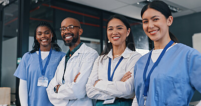 Buy stock photo Doctors, group and happy with arms crossed in hospital with confidence in medical goals or mission. Healthcare, team and portrait of people in clinic working in medicare with pride and diversity