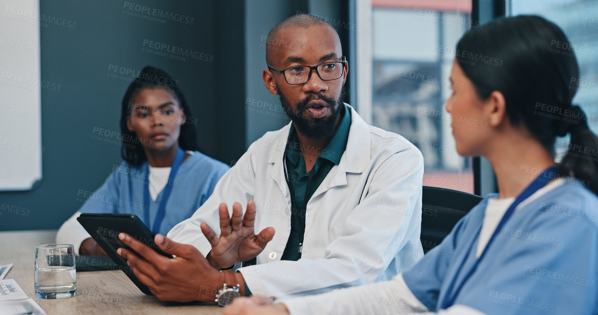 Buy stock photo Medical, tablet and teamwork in meeting for research, planning and discussion in hospital. Healthcare nurses and doctor with internet for communication, news report or feedback in collaboration.