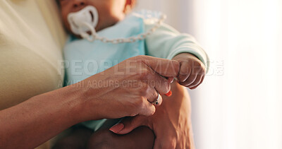 Buy stock photo Love, baby and mother holding hands in a house with care, trust and security closeup while bonding. Children, safety and mama with kid at home with support, protection or calm, moment or nap routine