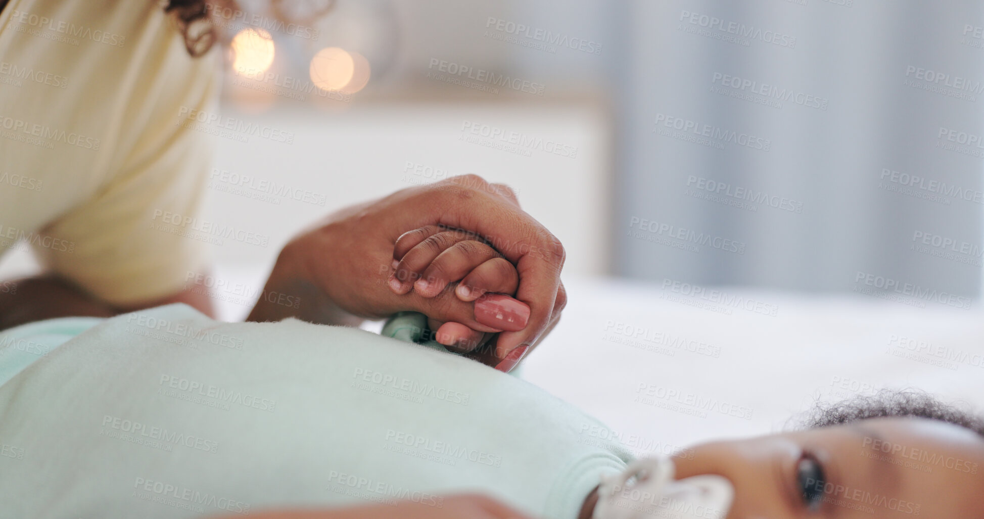 Buy stock photo Love, mother and baby holding hands on a bed with care, support and trust in their home together. Kids, bonding and mom in with child in a bedroom for playing, development or security and protection