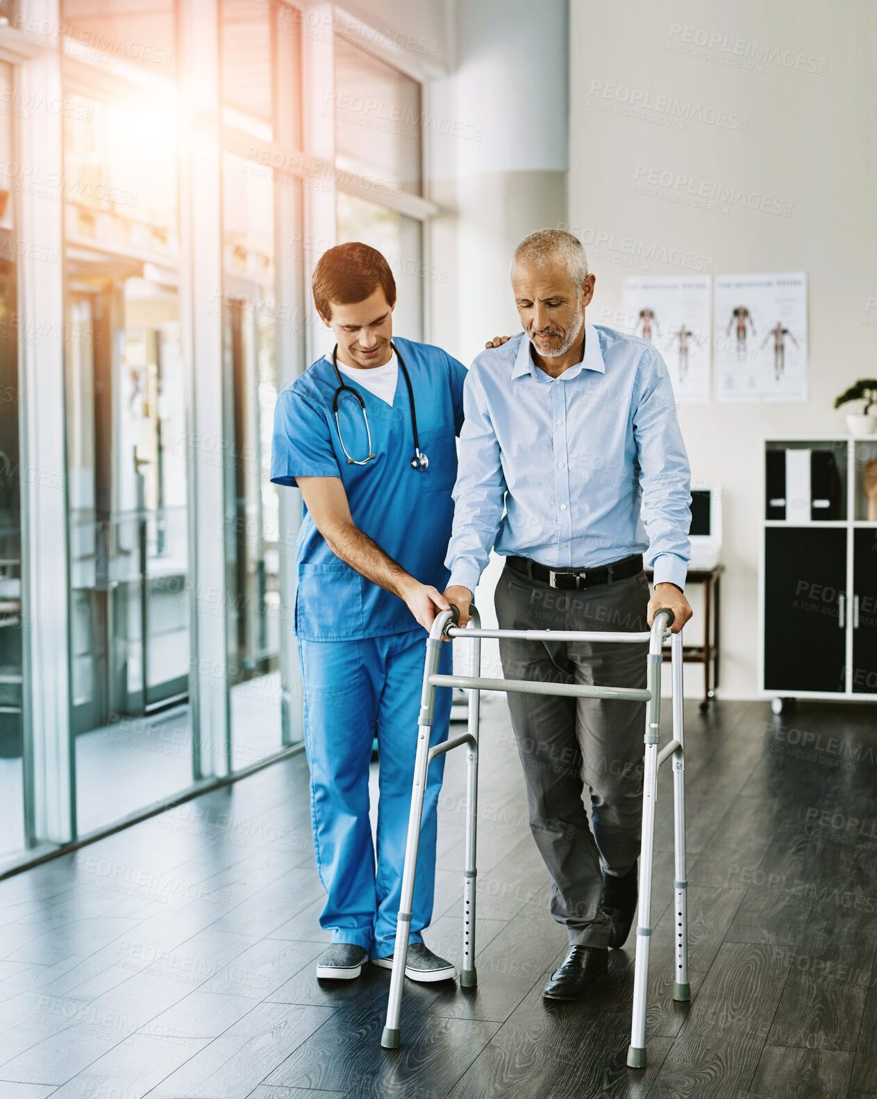 Buy stock photo Physiotherapist, senior man and walking frame with help, balance and guide for steps in hospital. Doctor, elderly person and mobility aid for recovery, rehabilitation and support with care at clinic