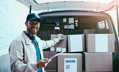 Buy stock photo Portrait of a cheerful young delivery man standing next to a van full of boxes while holding a digital tablet