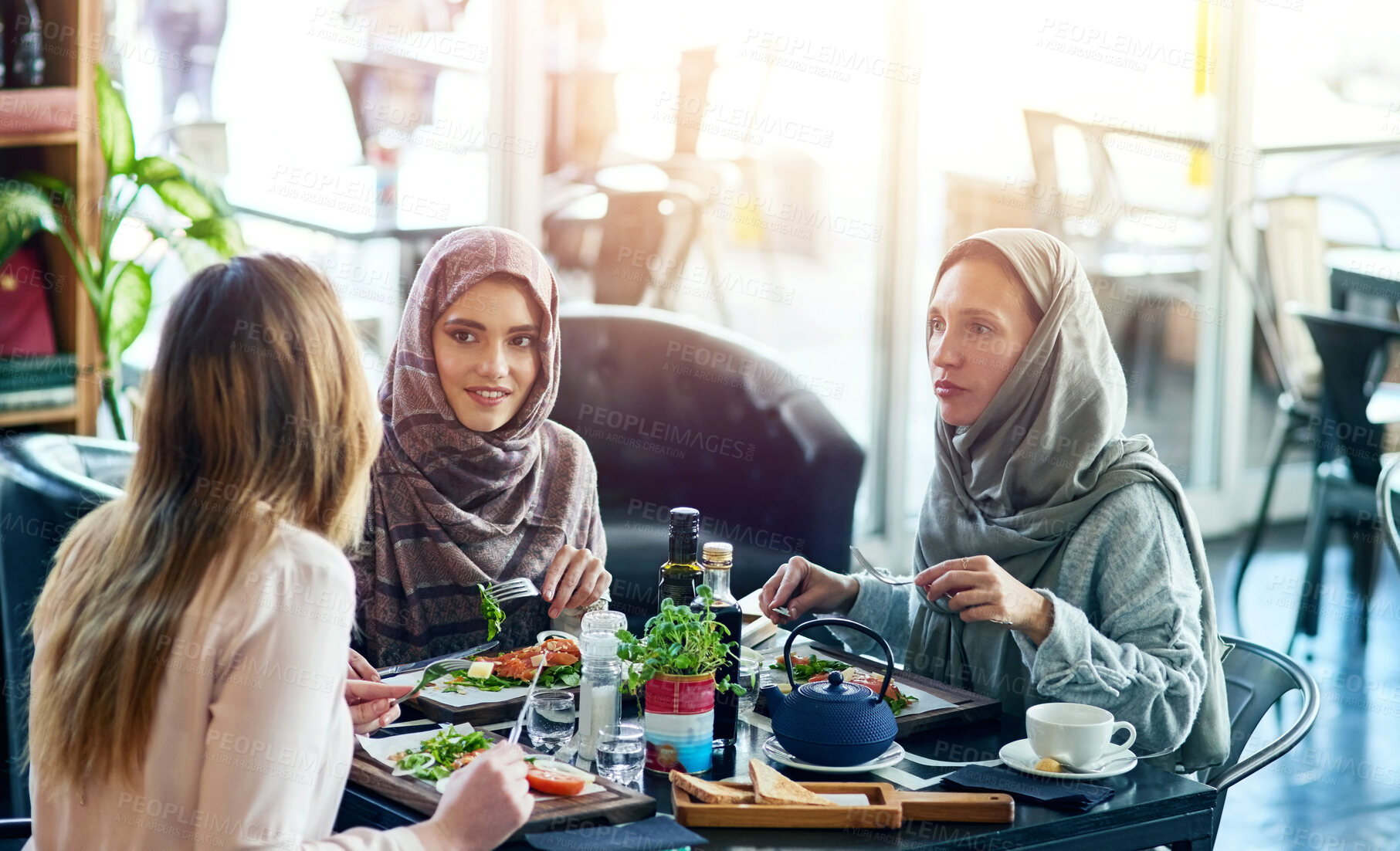Buy stock photo Restaurant, diversity and friends with food for chat, hangout and conversation with lunch in Turkey. Cafeteria, women and meal of salad, halal friendly and nutrition for eating while bonding together