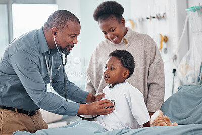 Doctor, hospital and child with breathe, checkup and consultation for lung health and wellness. Pediatrician, kid and clinic bed with bear, comfort and good news for healthcare and life insurance