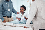 Doctor, hospital and child with medical, stethoscope and consultation for health and wellness. Pediatrician, kid and bed with communication, comfort and good news for healthcare and life insurance
