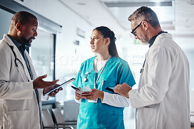 Clinic, teamwork and doctor with folder, conversation and brainstorming for healthcare and help. Medical, leader and senior professional with group, advice or meeting with documents or administration