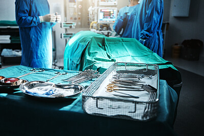 Surgery, table and equipment for operation in hospital for medical transplant treatment. Healthcare, scissors and blur of surgeons working with metal surgical tools for healthcare procedure at clinic