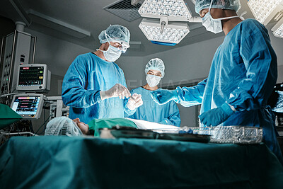 Buy stock photo Surgeon group, people and operating room at hospital in scrubs, ppe and help for emergency healthcare procedure. Doctors, team and together in icu, medical surgery and services for wellness at clinic