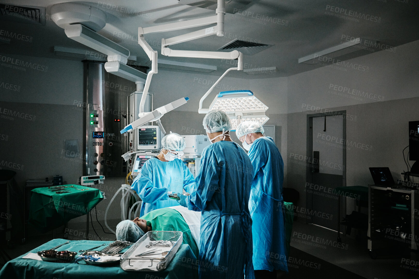 Buy stock photo Surgery, theatre or surgeons with teamwork for emergency, accident or healthcare in hospital clinic. Light, medical operation or doctors in surgical collaboration in operating room to support or help