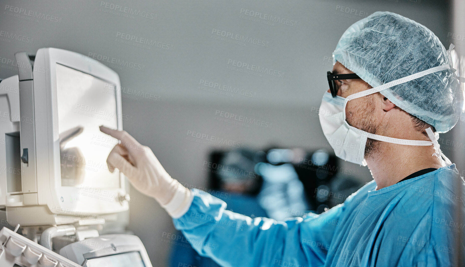 Buy stock photo Doctor, scrubs and monitor with machine in theatre for surgery, cardiology analysis and information. Medical, man and digital technology in hospital for operation, procedure or healthcare examination