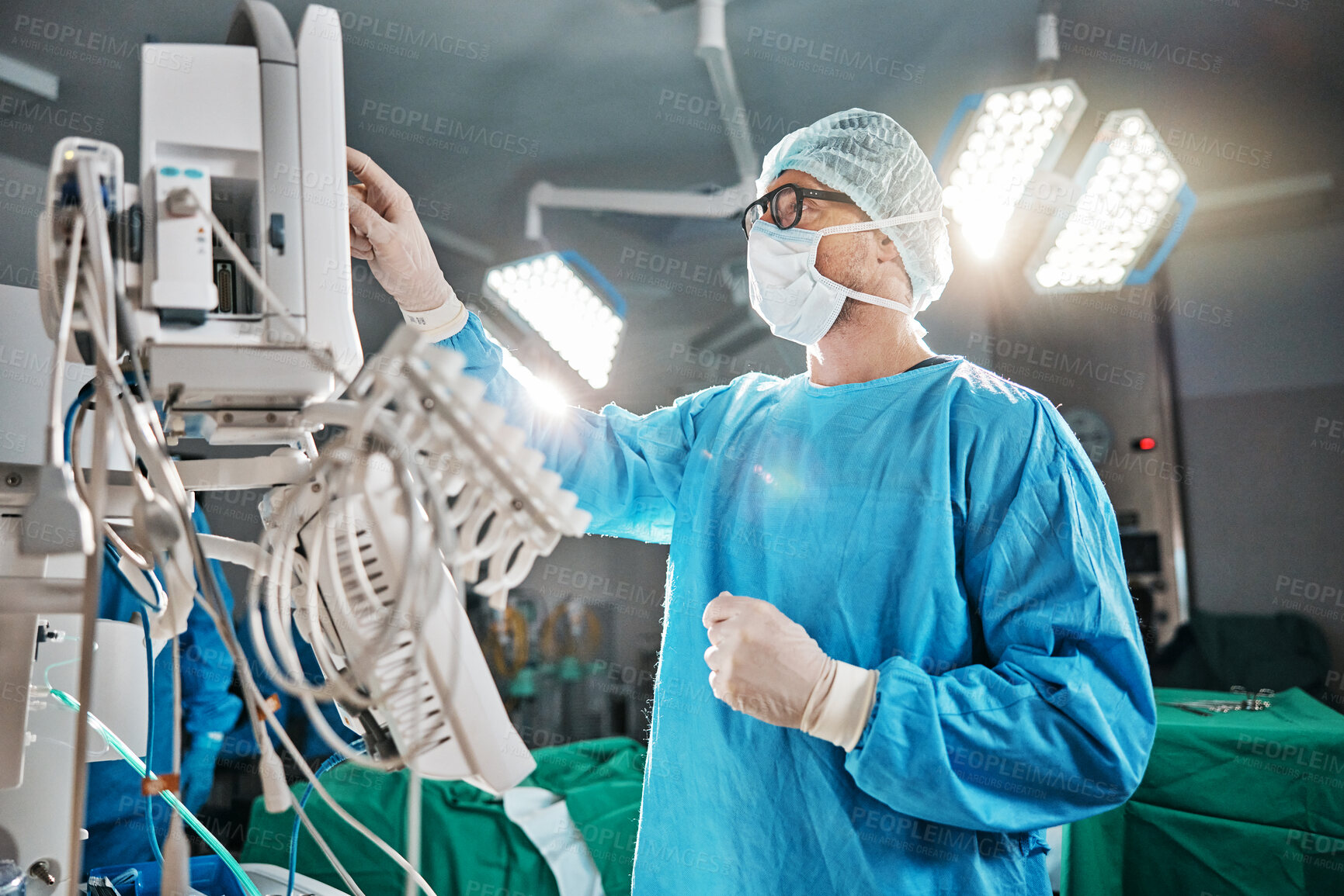 Buy stock photo Healthcare, scrubs and doctor with machine in theatre for surgery, cardiovascular operation or analysis. Medical professional, man and ecg monitor for cardiology, procedure or information in hospital