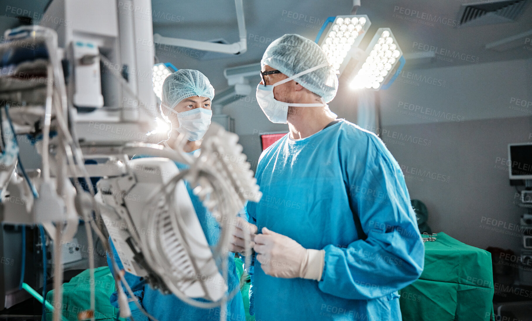 Buy stock photo Hospital, theatre and surgeon talking, teamwork and working together for healthcare with mask. Medical, men and male people as doctors in clinic for surgery, service and collaboration in job