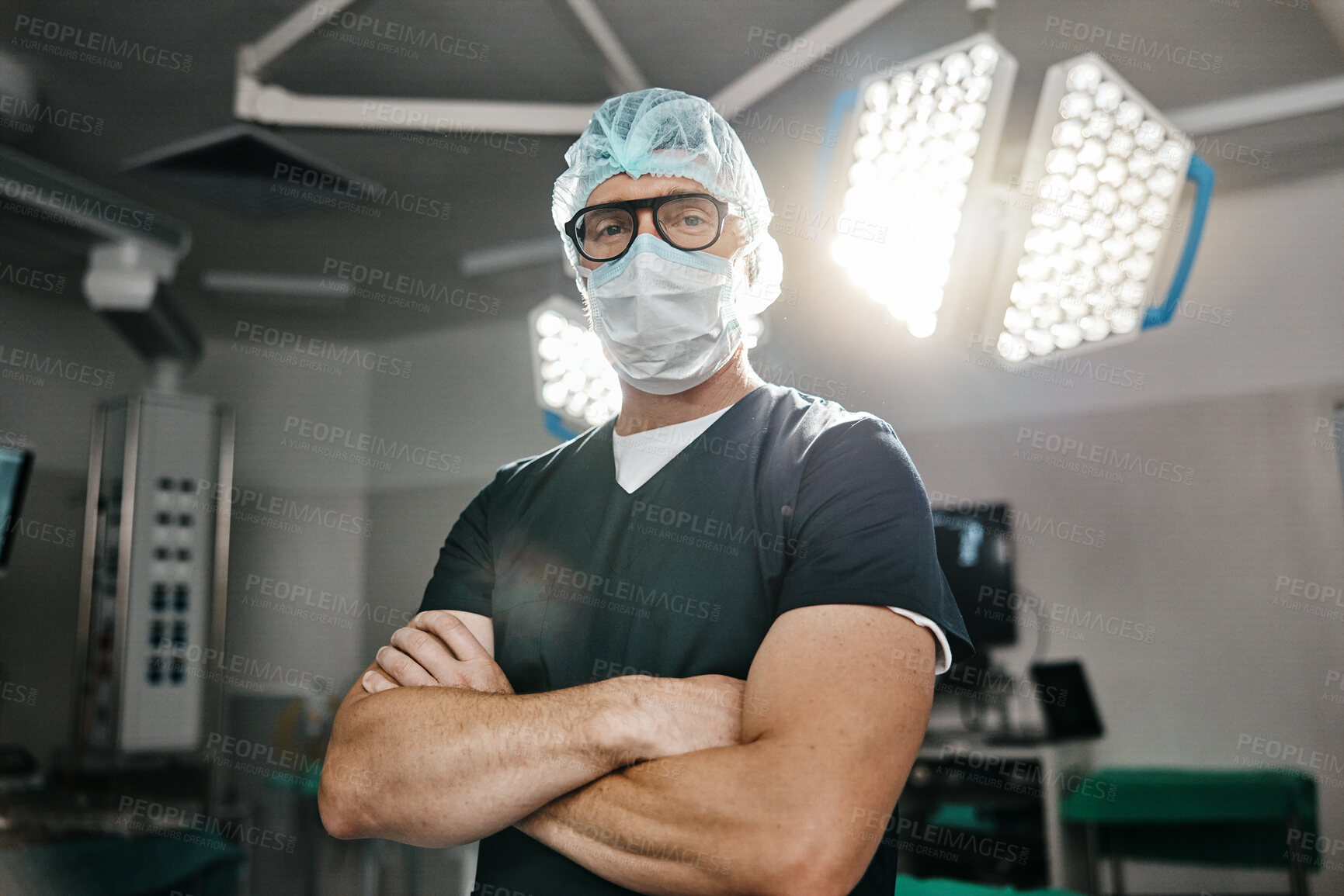 Buy stock photo Surgery, portrait and arms crossed by man doctor in operating room with confidence in medical, healthcare or emergency. Hospital, face mask and male surgeon in theatre with pride, help or leadership