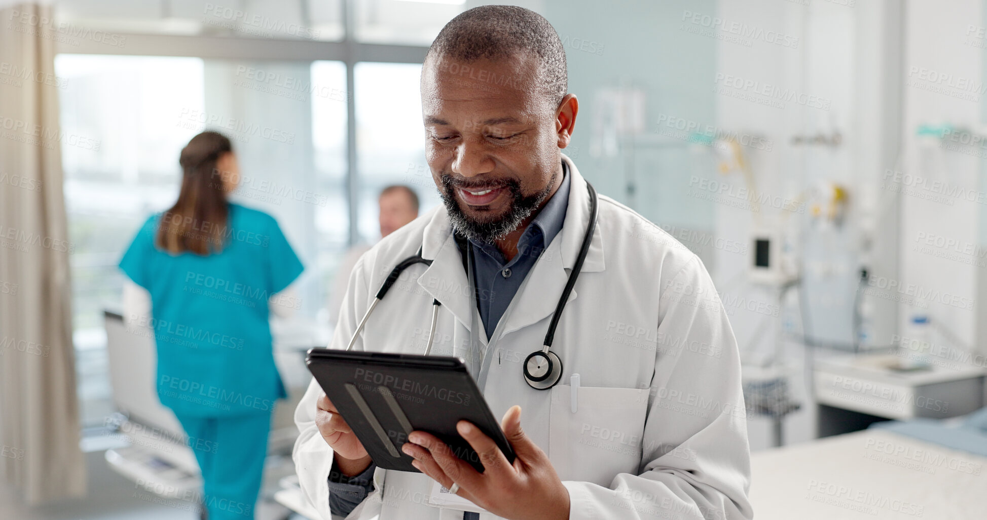 Buy stock photo Happy, typing and black man with a tablet, doctor and clinic with connection, email notification and research. African person, employee and medical professional with tech, healthcare and digital app