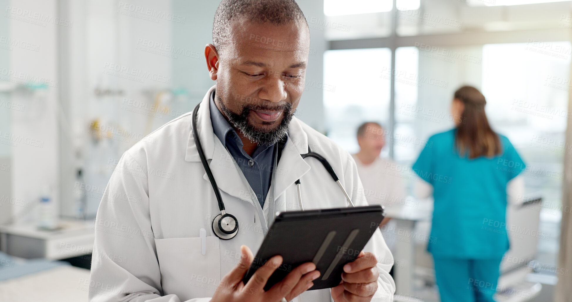 Buy stock photo Happy, typing and black man with a tablet, doctor and clinic with connection, email notification and research. African person, employee and medical professional with tech, healthcare and digital app