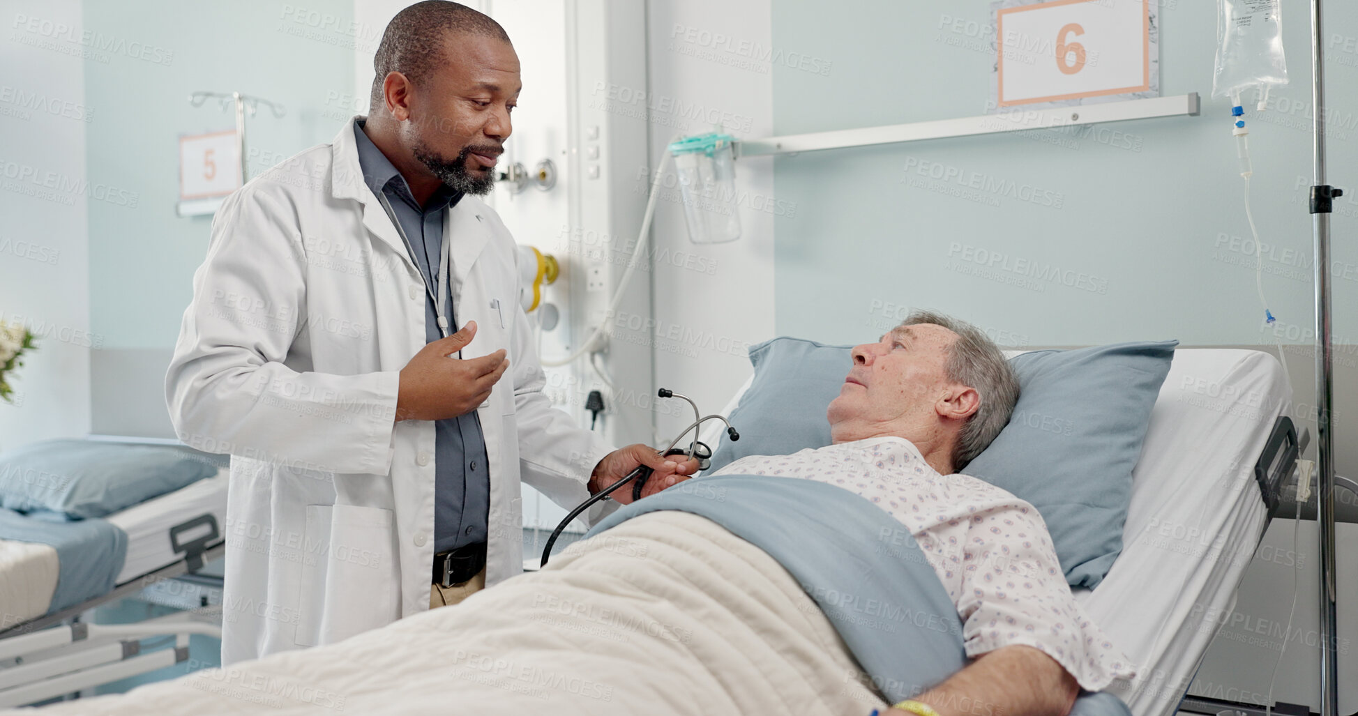 Buy stock photo Medical stethoscope and doctor with patient in hospital after surgery, treatment or procedure. Discussion, checkup and African male healthcare worker talk to senior man in clinic bed for diagnosis.