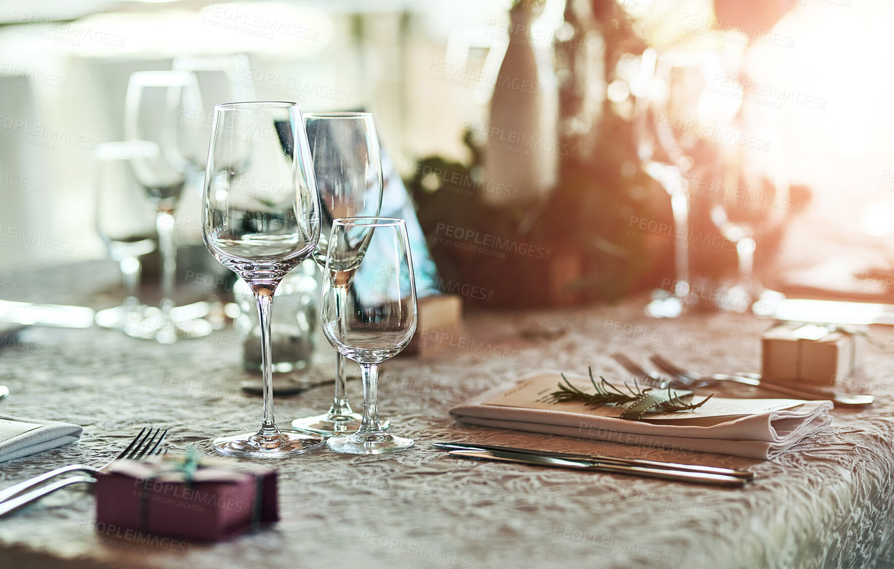 Buy stock photo Wedding, table and glasses for occasion arrangement, celebration and fine dining with place setting. Party favour, catering and theme decoration for social gathering, reception and elegant lunch