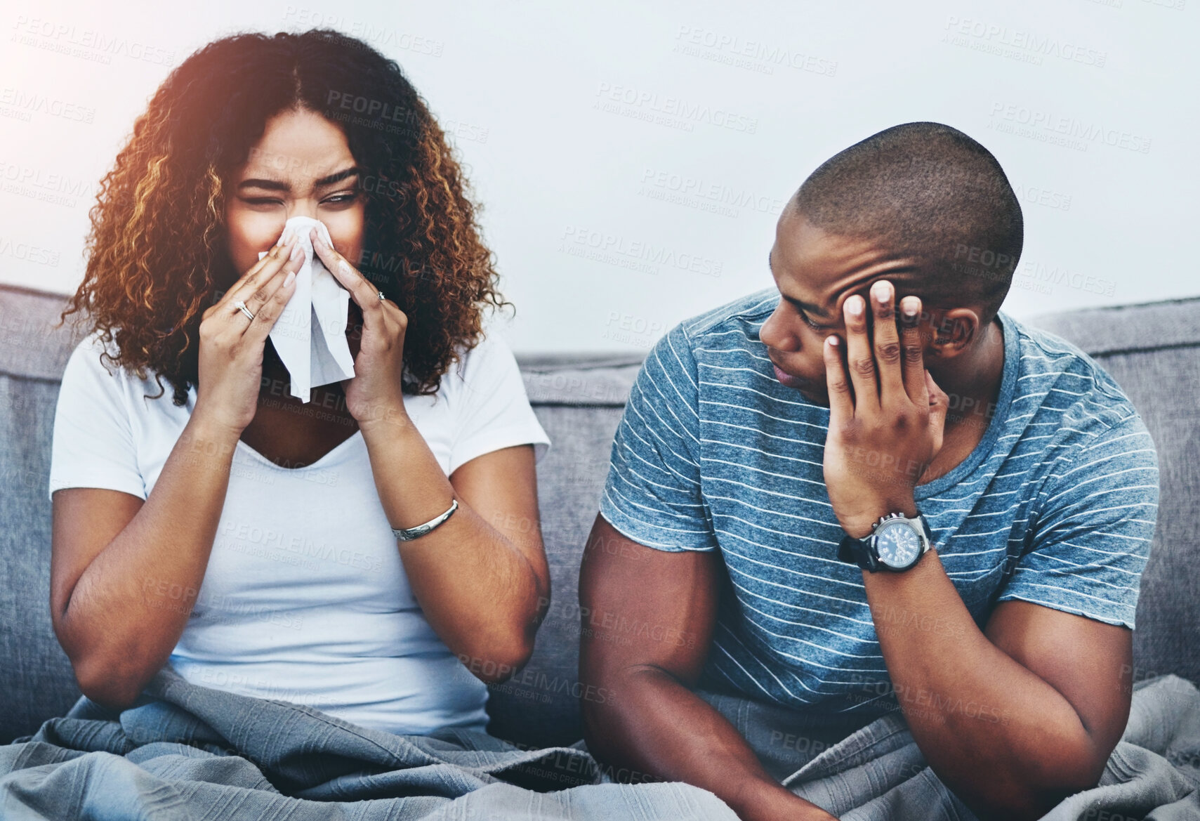 Buy stock photo Frustrated couple, sick and argument with fight on sofa in disagreement, conflict or allergies at home. Man or woman blowing nose with tissue for flu, cold or illness in breakup or toxic relationship