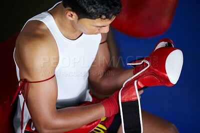Buy stock photo Strong, getting ready and a man with gloves for boxing, a fight competition or gym training. Fitness, club and a boxer or fighter with equipment to start sports, exercise or martial arts match