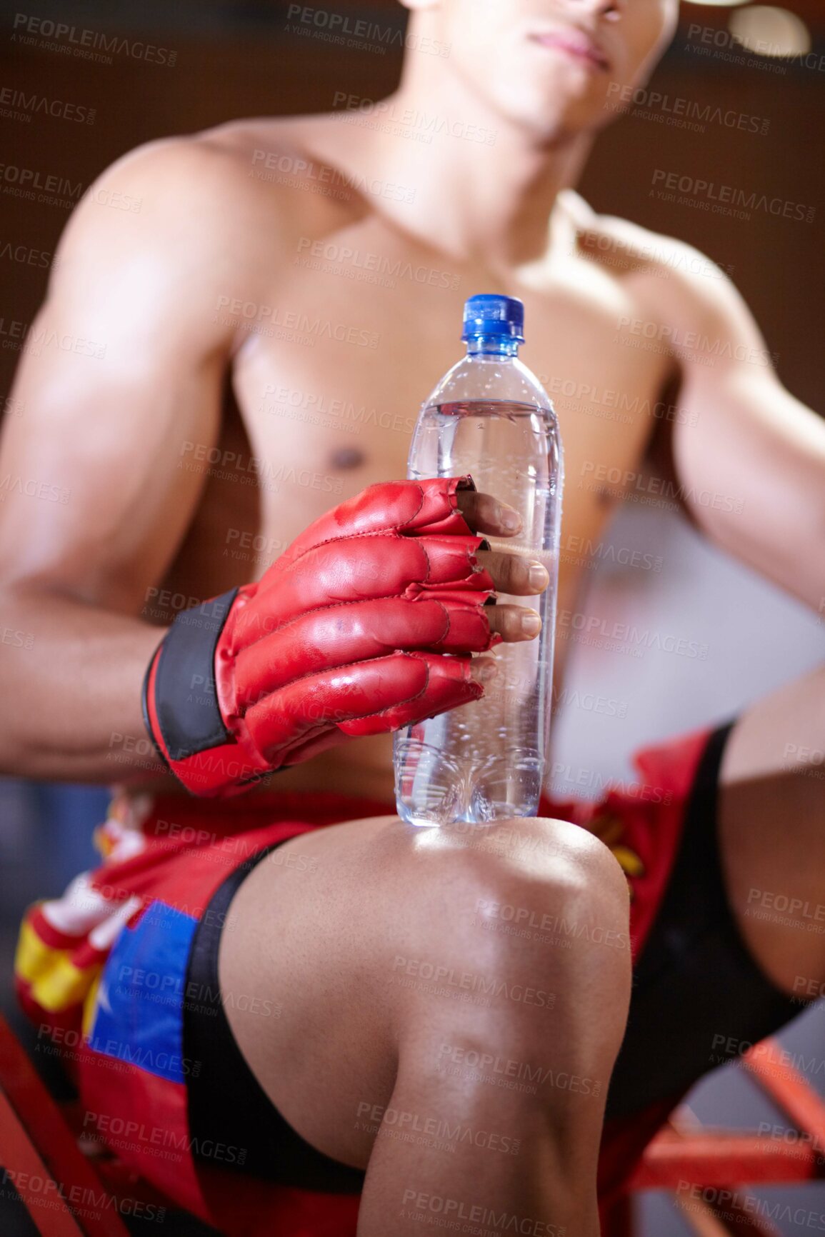 Buy stock photo Man, boxing and hands with water bottle for workout or fight in ring, match or training in gym. Health, fitness and fighter with a drink in exercise or rest break for wellness in fighting competition
