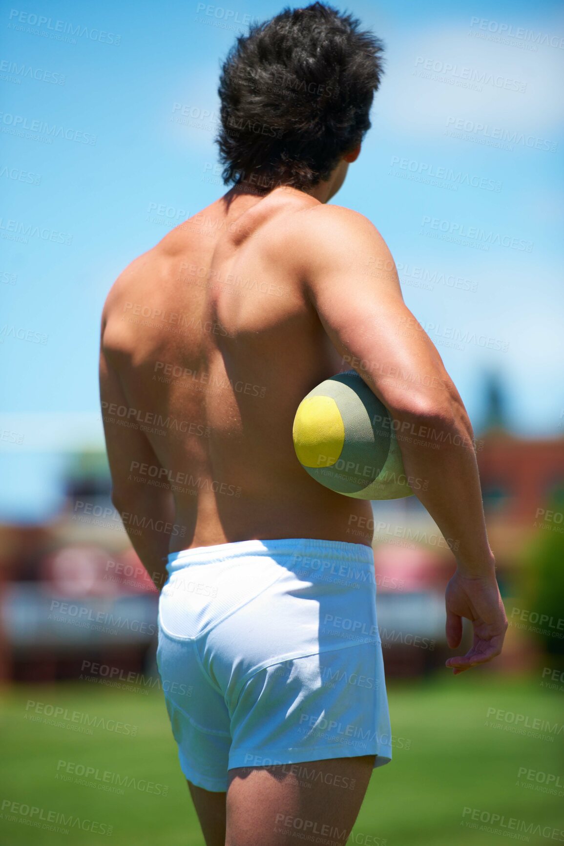 Buy stock photo Back, rugby and player with ball on a field ready for a competitive practice game. Topless and male person with an object for exercise or training from behind and shirtless playing outside for sport
