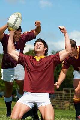 Buy stock photo Rugby, sports and happy with winner and man on field for celebration, teamwork and challenge. Training, success and achievement with group of people for support, collaboration and competition