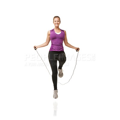 Buy stock photo Portrait, skipping rope and woman on a white background for cardio workout, exercise and training. Sports, fitness and isolated person with gym equipment for health, wellness and jumping in studio