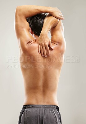 Buy stock photo Back, topless or man stretching arms for fitness, body workout or flexibility isolated on grey background. Healthy male model, spine or sports athlete in exercise, warm up or training in studio