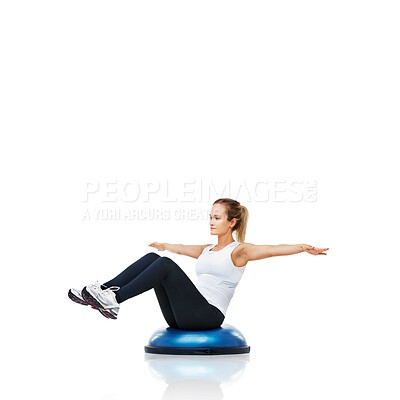 Buy stock photo Balance, exercise and woman with bosu ball in workout, core training and wellness on white background. Muscle, strength and power with challenge on mockup space, athlete and fitness tools in studio