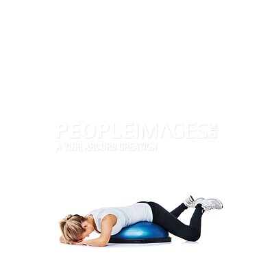 Buy stock photo Woman, balance ball and lying for workout, exercise or fitness on a white studio background. Young active female person or athlete on half round object for training, health and wellness on mockup space