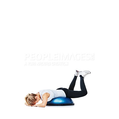 Buy stock photo Woman, ball and lying in fitness for balance, exercise or workout on a white studio background. Young active female person or athlete on half round object for health and wellness on mockup space