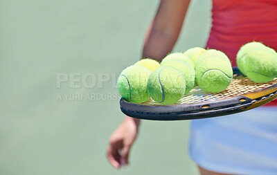 Buy stock photo Woman, tennis player and balls on racket for outdoor game, match or competition on court. Closeup or hands of female person or athlete in sports with bat and equipment for training on mockup space