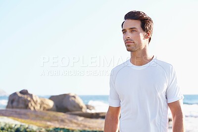 Buy stock photo Fitness, thinking and space with man at beach in summer for sports, training or cardio on blue sky. Exercise, vision and health with young runner or athlete by ocean or sea for physical workout