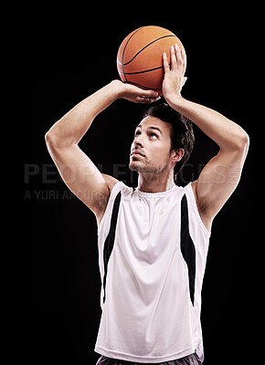 Buy stock photo Basketball, shooting and man in studio with fitness, training or game target practice on black background. Sports, exercise or male player with handball for body workout, performance or aim challenge