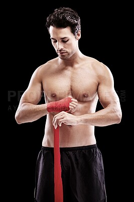 Buy stock photo Man, hand wrap and fitness with fighter in a studio ready for boxing training and workout. Body, athlete and male boxer from Brazil with exercise, sport and wellness for battle with black background