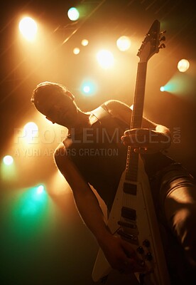 Buy stock photo Concert, band and guitar with man on stage for music, performance and rock show. Event, spotlight and energy with male musician playing instrument at festival club for rave, disco and  celebration