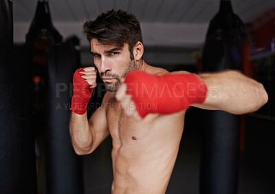 Buy stock photo Man, portrait and ready for boxing or fight, fitness and topless for exercise and workout. Male person, bodybuilder and punching bag for challenge or practice, training and serious for competition