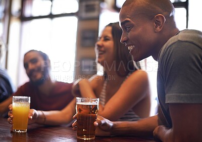 Buy stock photo A cropped shot of friends having drinks in a bar