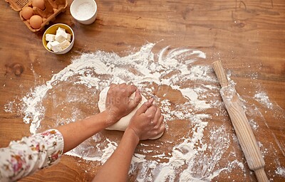 Buy stock photo Chef, hands and recipe for dough on table, baking in kitchen and above process in bakery. Person, prepare and press bread with flour for meal prep and learning information from guide in book