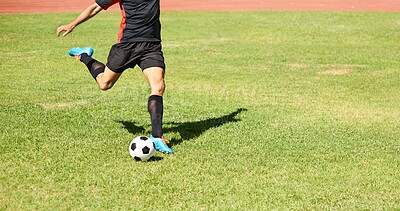 Buy stock photo Shot of a young footballer playing with a ball outdoors
