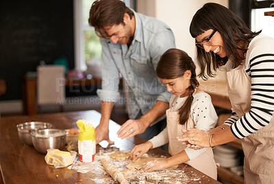 Buy stock photo Mother, father and girl with baking cake in kitchen with oven, happiness and teaching with support. Family, parents and child with helping, learning and bonding with cooking for dinner and cookies